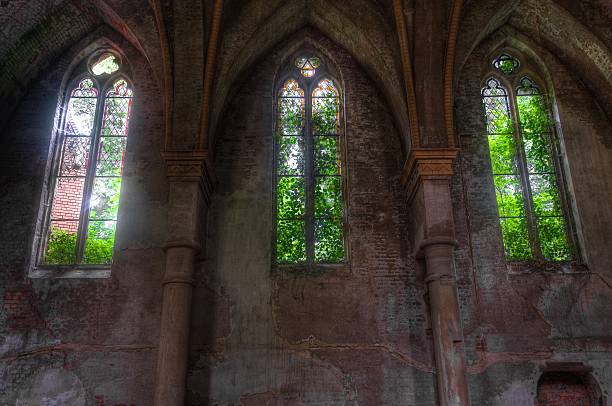 istock Abandoned church with old stained glass window 502684737