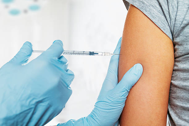 Medical vaccine in shoulder stock photo
