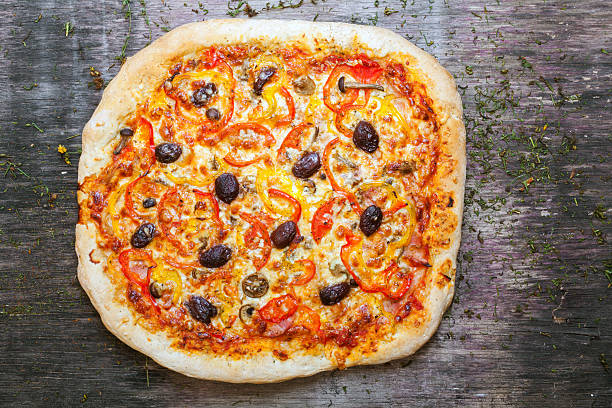 istock Delicious italian pizza served on wooden table 502688581