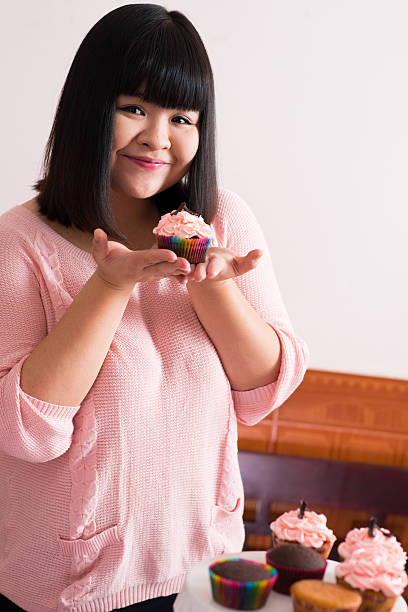 istock Girl with cupcake 502689481