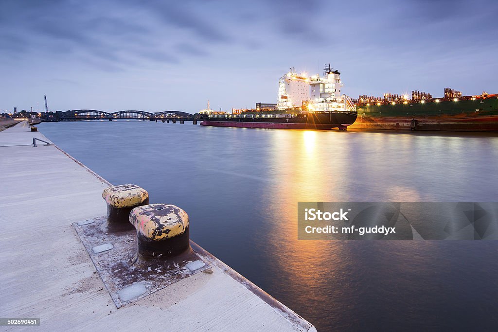 Hamburg Harbour, cargo vessel Hamburg Cargo terminal on a blue evening. Activity Stock Photo