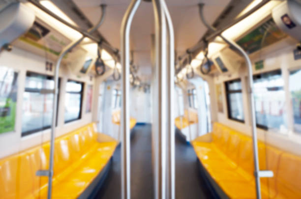 istock Inside train has row of yellow seat, blurred, empty. 502696370