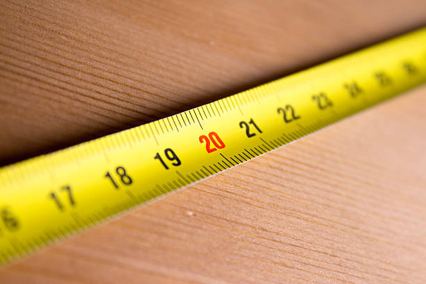 istock Measuring tape on wood 502696376