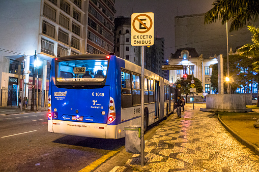 Sao Paulo, Brazil, November 12, 2015. Vehicle and people on Bus stop in Sao Francisco Square at night, downtown Sao Paulo
