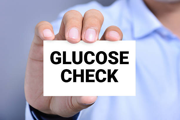 istock GLUCOSE CHECK message on the card show by a man 502702236