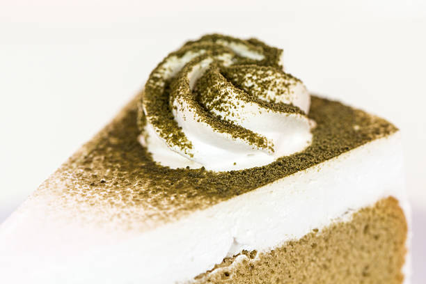 A piece of green tea cake on isolate white background