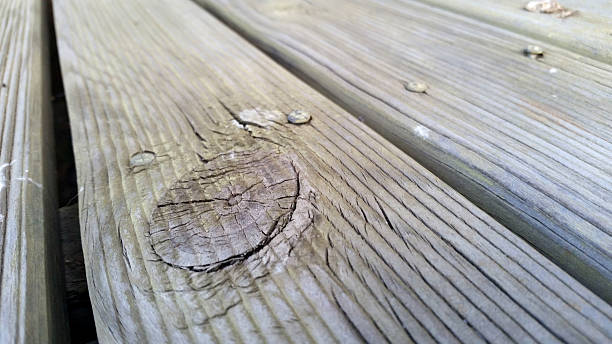 istock Old wooden deck with knot 502702480