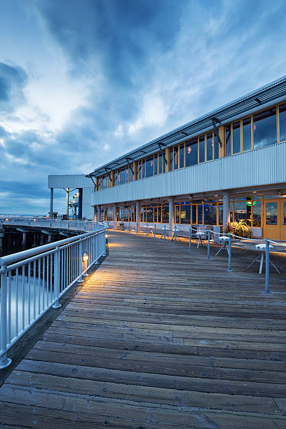 istock empty wooden footpath front of architecture at dusk 502702700