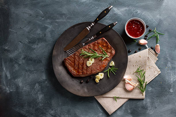 istock Grilled steak with garlic 502705570