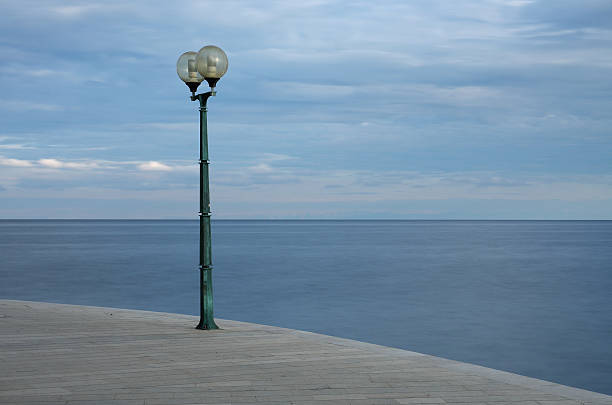 istock Light on sidewalk in coast town of Porec 502706426