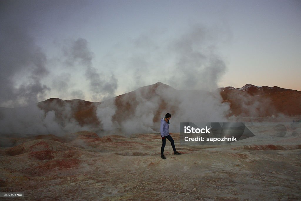 female walking on geyser and fumaroles Bolivia 2015 Stock Photo