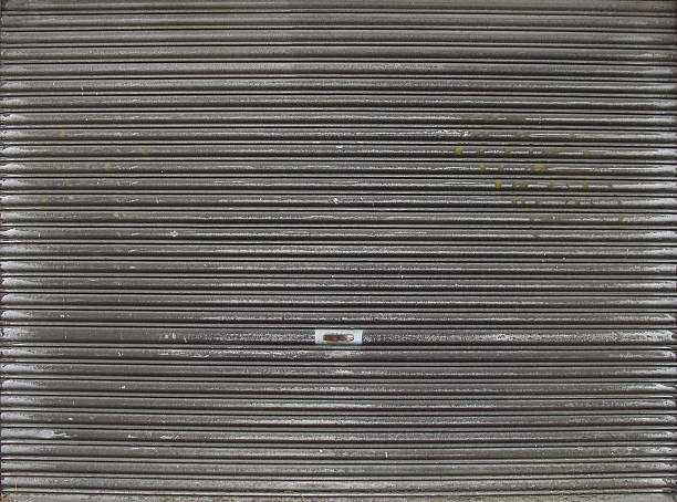 istock very dirty nearly black metal garage roller shutter 502707917