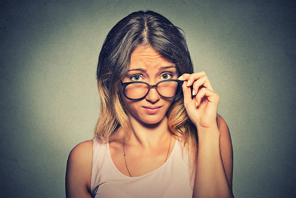confused skeptical woman looking at you with disapproval