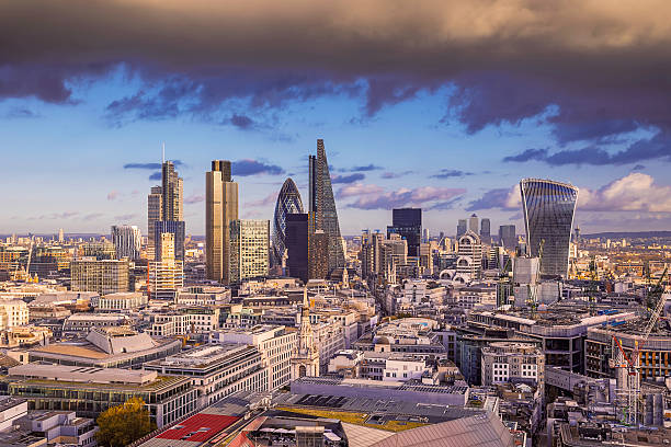 istock Dark clouds over London's business district at sunset, London, UK 502710060