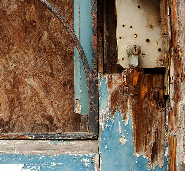 istock old rusty wood vandalized door and lock 502721425