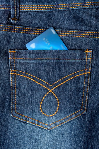 Debit card placed in back pocket of a jeans