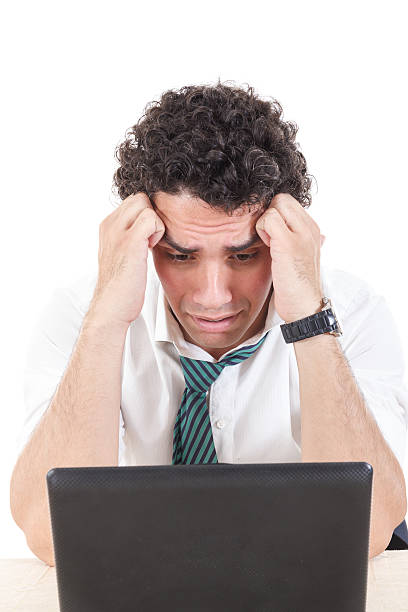 istock sad caucasian business man frustrated with work sitting in front 502727573