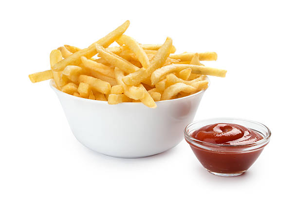 istock French fries with ketchup on white 502728339