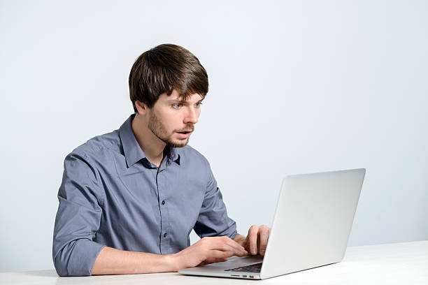 istock Young man working at laptop 502731050