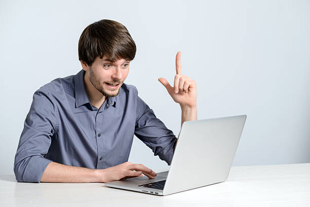 istock Young man working at laptop 502731290