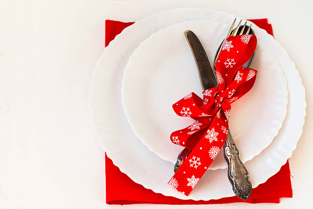 istock Christmas plate and silverware with red ribbon 502731774