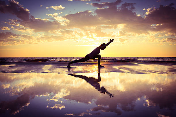 istock woman practicing yoga 502732598