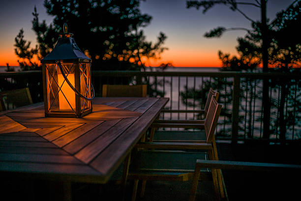 istock Lantern on a Table by the Ocean at Sunset 502732906