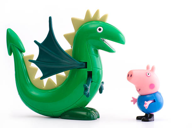 george świń, z zielonej dinozaur - peppa pig figurine toy zdjęcia i obrazy z banku zdjęć