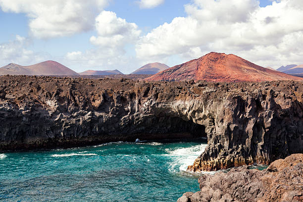 istock Shoreline cave and volcano 502734812