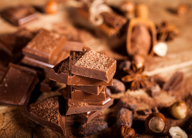 Chocolate pieces on wooden background