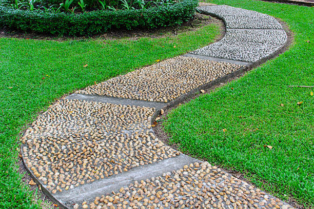 istock Stone walkway in the park with green grass 502739323