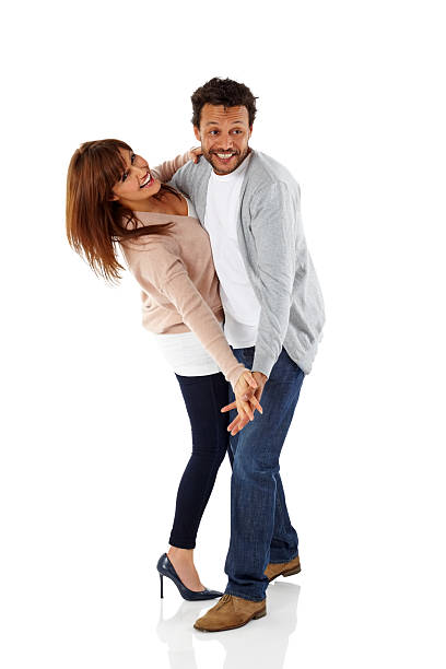 istock Attractive mature couple dancing on white 502740779