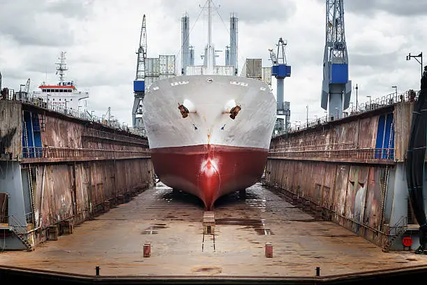 Commercial dock, wharf, ship and gantry crane, port of Rotterdam