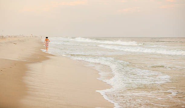 istock Girl running at the beach 502741659