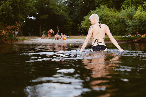 Woman wading in a Lake