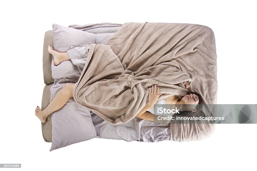 Female Insomniac Suffering From Sleep Deprivation in Bed top view of young female in bed unable to sleep Bed - Furniture Stock Photo