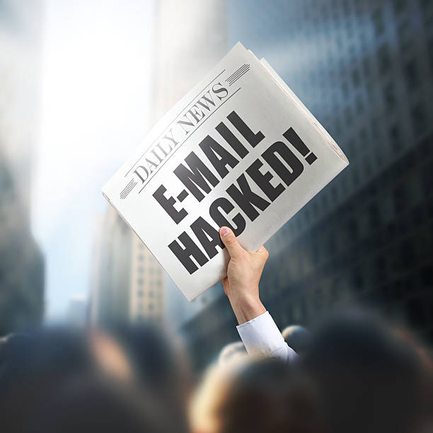 istock Holding Newspaper with Email Hacked 502742539