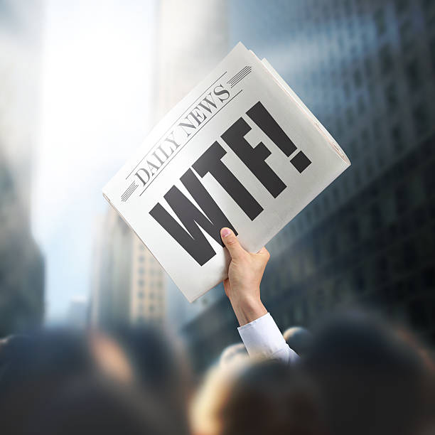 istock Holding Newspaper with WTF 502743343