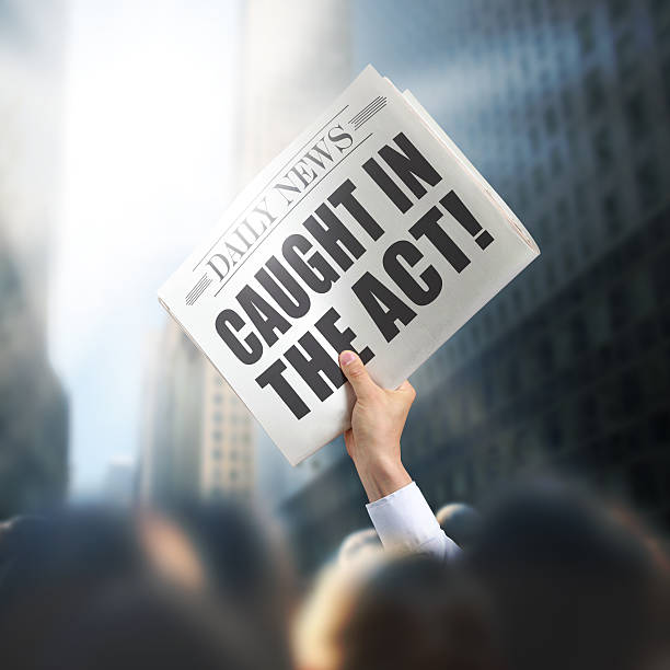 istock Holding Newspaper Caught in act 502743353