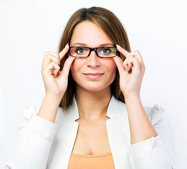 Woman testing new glasses isolated portrait