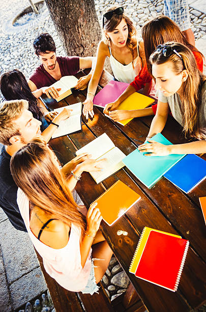 Group of students sitting in the stairs at the university