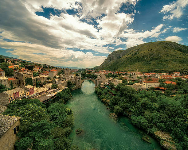 Mostar Cityscape Aerial view on Mostar old town. Neretva, the Old bridge and both banks where old settlement is built.  stari most mostar stock pictures, royalty-free photos & images