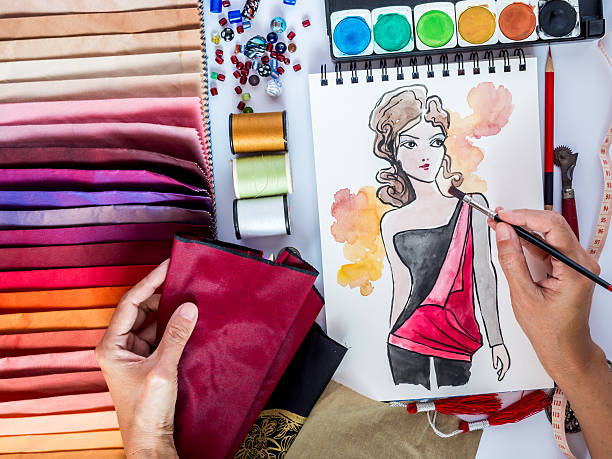 istock Fashion designer working with material sample and hand-drawn illustration 502745455