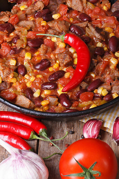 istock Mexican chili con carne close-up vertical view from above 502745701