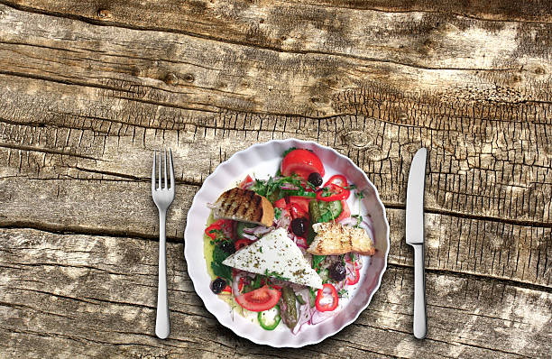 istock Closeup of vegetable salad on a plank background 502750652