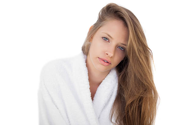 istock Pensive brunette in bathrobe looking at camera 502752163