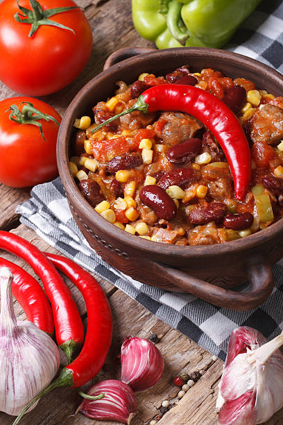 istock chili con carne in a pot and ingredients. vertical 502752703