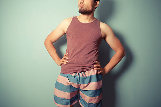 istock Young man standing with hands on his hips 502753335