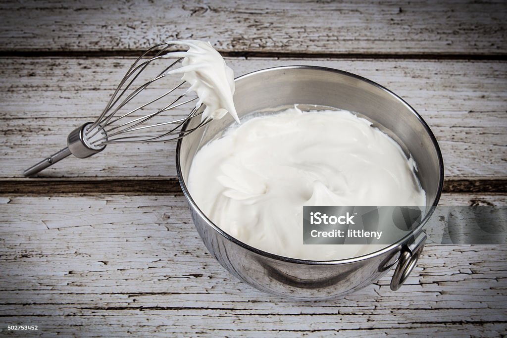 Whipped Cream Bowl of whipped cream and whisk Whipped Cream Stock Photo