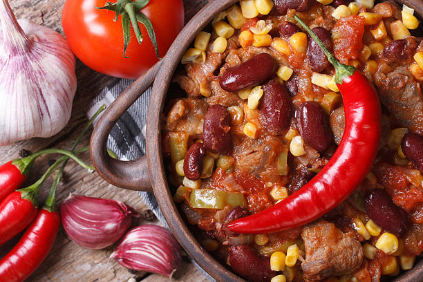 istock hot chili con carne in a pot macro top view 502753653